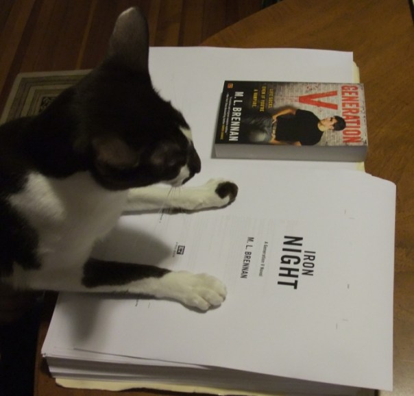 The author’s cat proudly surveys the page proofs. “Yes,” she thinks. “Right here is where I will vomit tonight.”